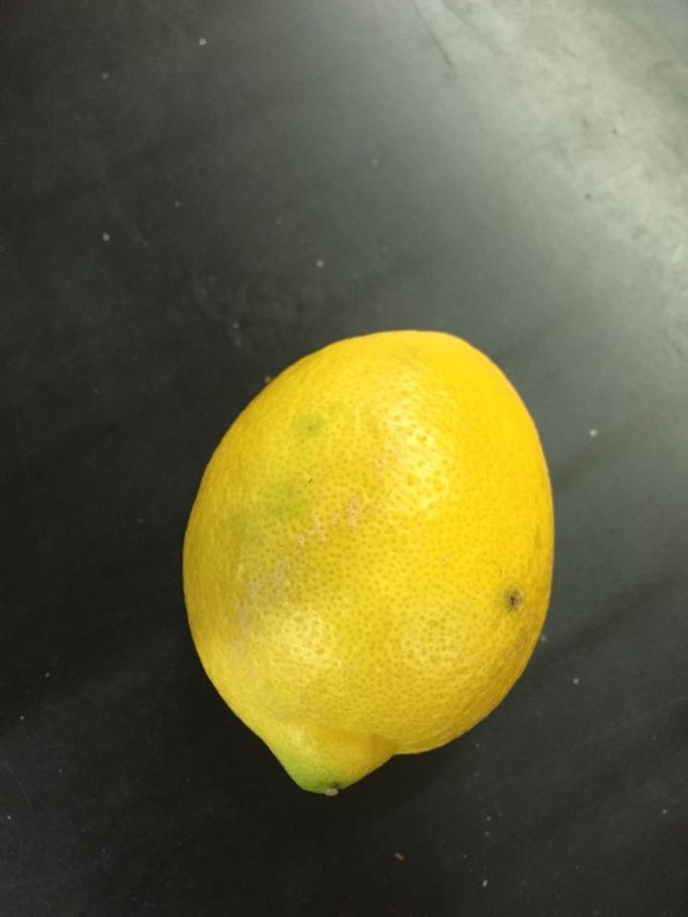 Juice \u00bd a lemon into a bowl and mix with water.