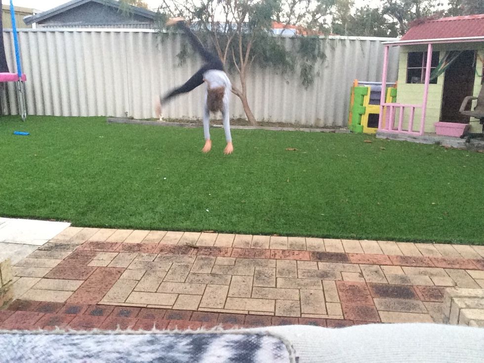 Jump as high as you can but still reach out to the ground. This will get you that late start that you want.