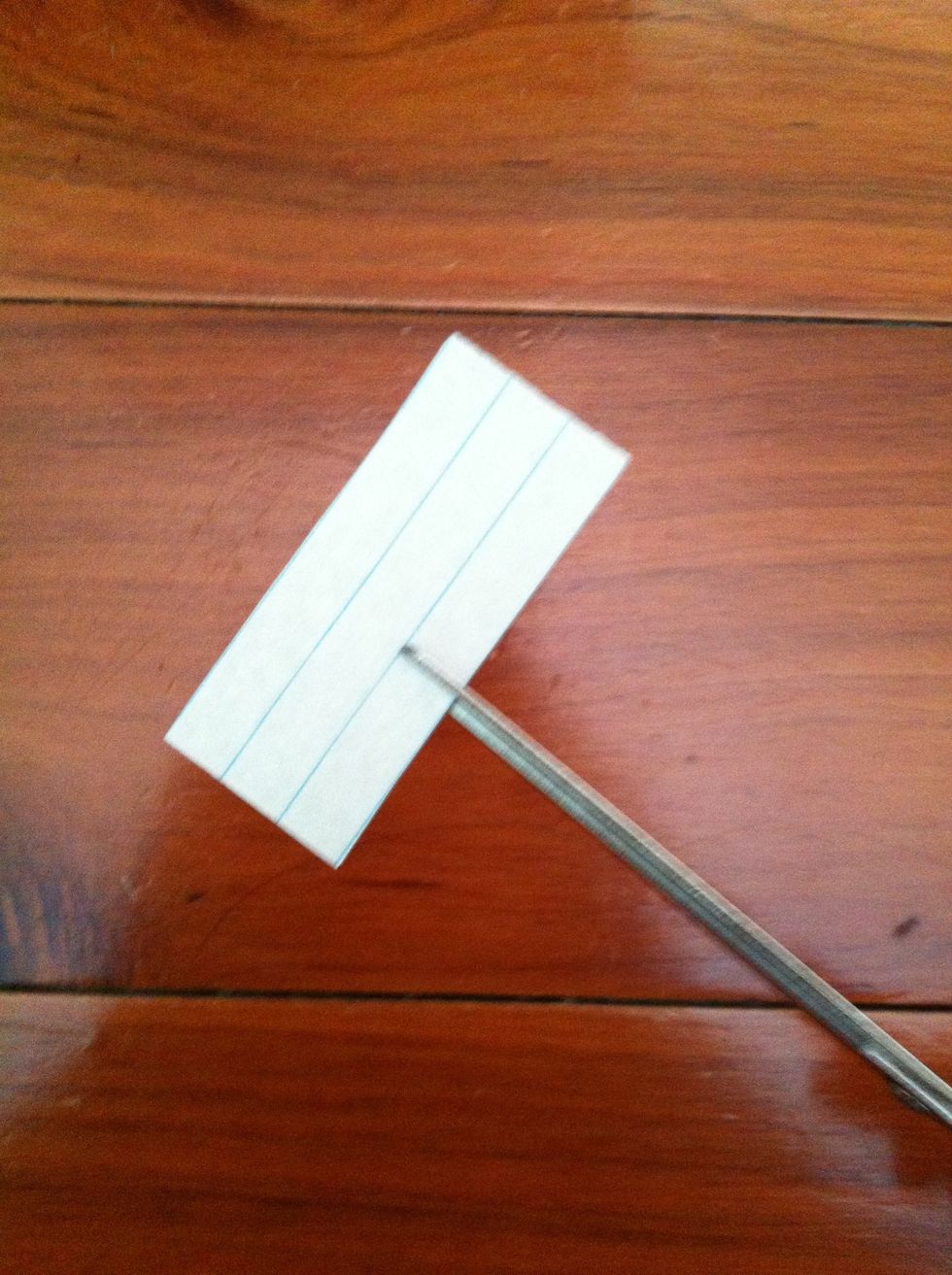 Just a little bit below the middle, cut a third of the paper, like this
