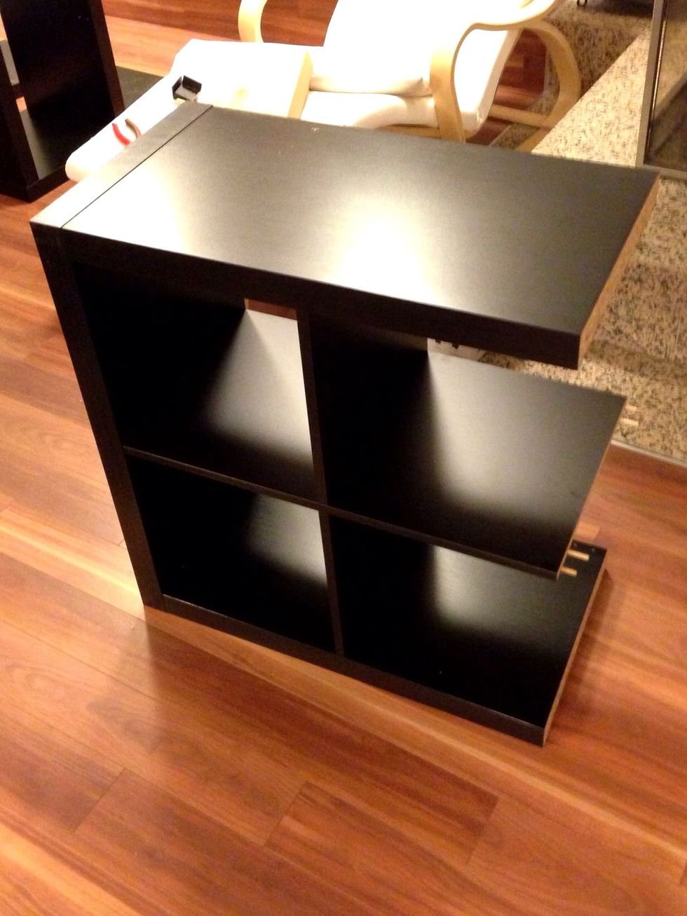 Just assemble the 2x2 shelf without adding the last large side panel.
