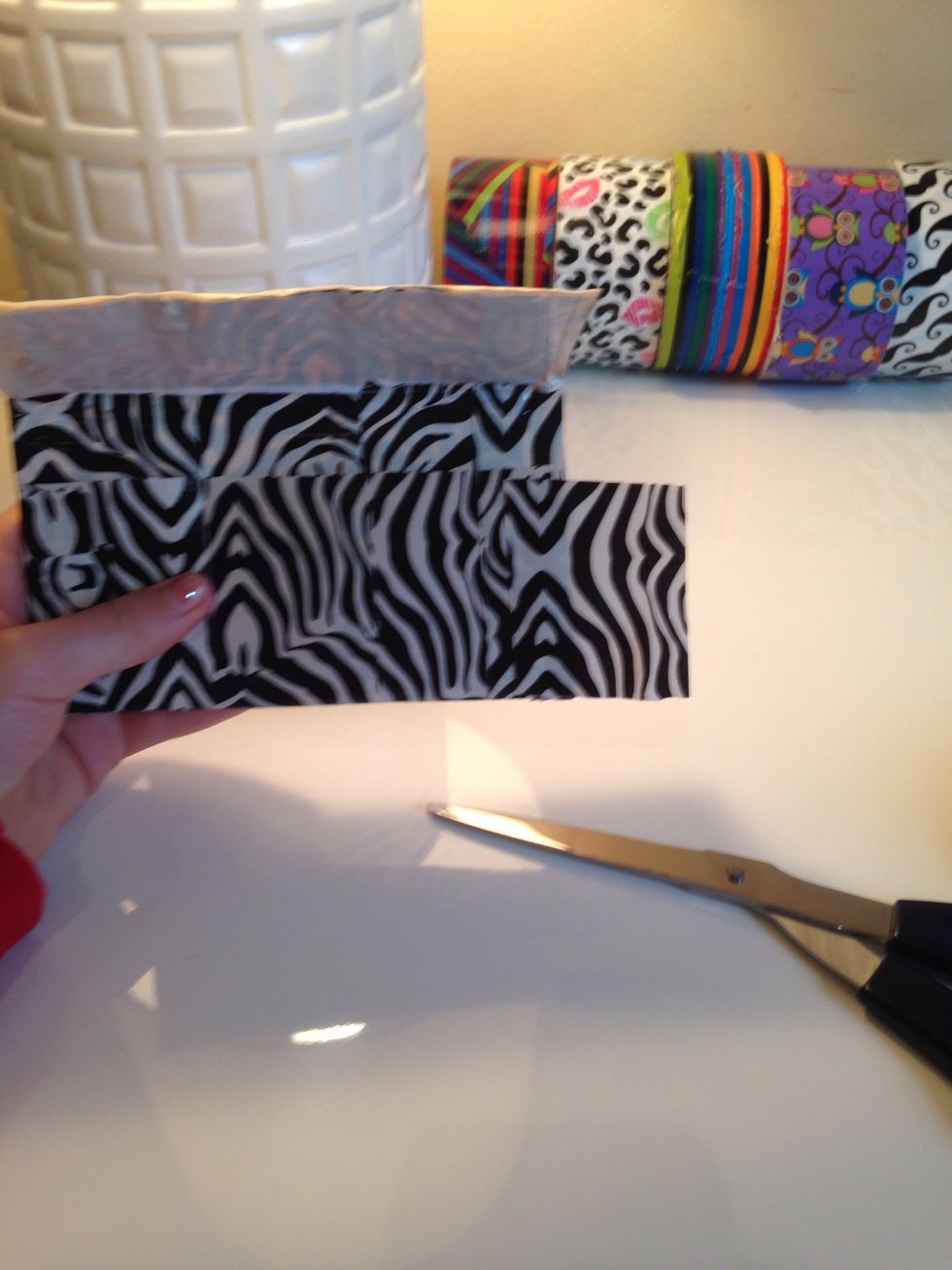 Just cut another square and tape it again