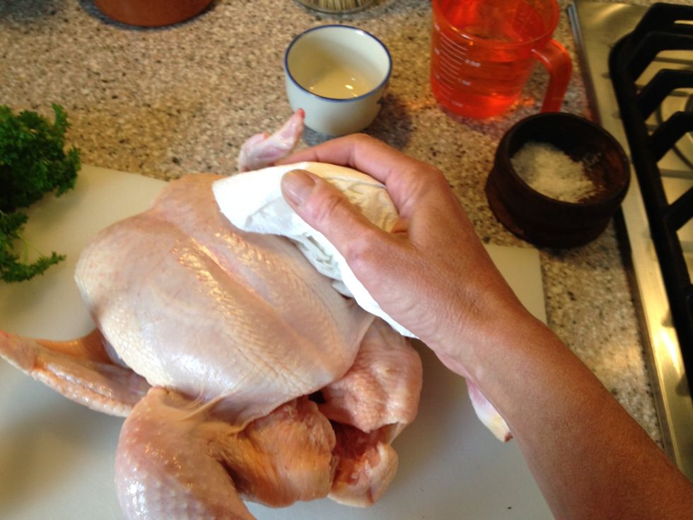 Just dab your chicken dry out side and in. Don't rinse with water, you want to remove moisture on the surface not add. Sprinkle with salt and pepper in side.