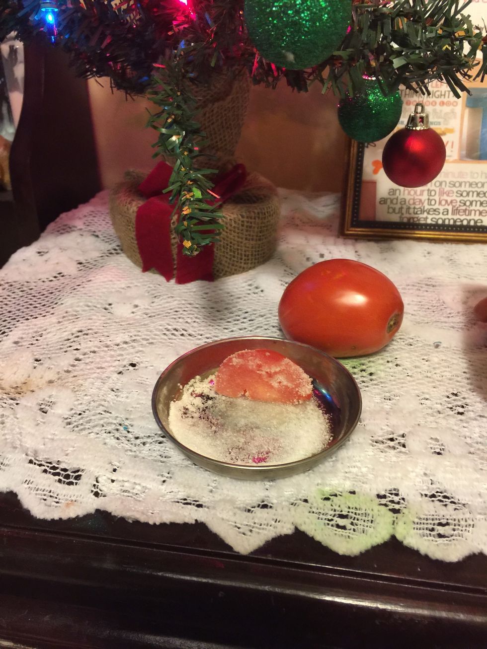 Just dip a piece of the tomato into the sugar and scrub away all the dead skin cells from your face !