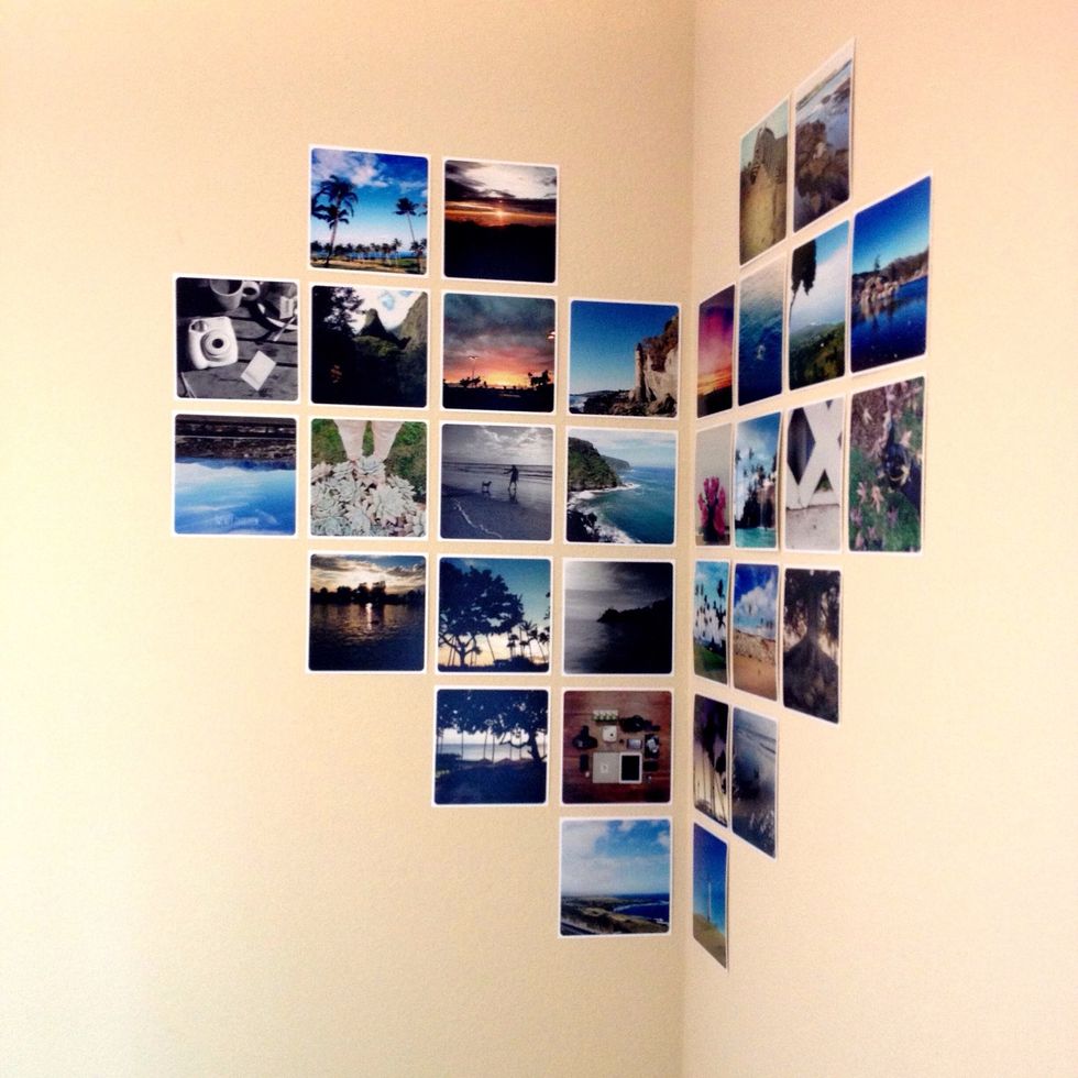 Just eyeball the space between or use a ruler as a guideline. Simply follow our photo as a guide on where to put the prints to get the corner heart look. 32 prints were used total.