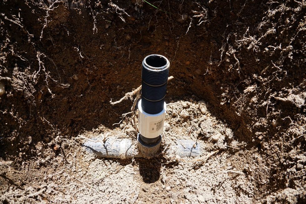 Just in case you wanted to keep the male fitting, here is how to adjust the height of the head, if needed. That white fitting is a PVC coupling, and the black part is that adj. nipple from earlier.