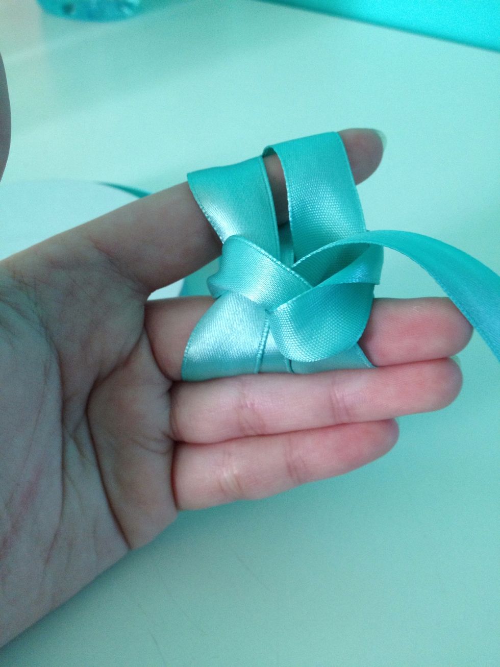 Just like in Step 12, tie the knot firmly.