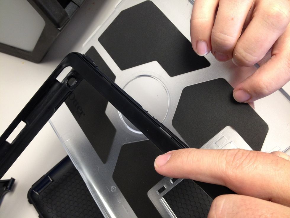 Just like that. Remove that silicone guardian, or as Charles refers to it, "the trim piece". After you have the case broken down, grab your iPad.