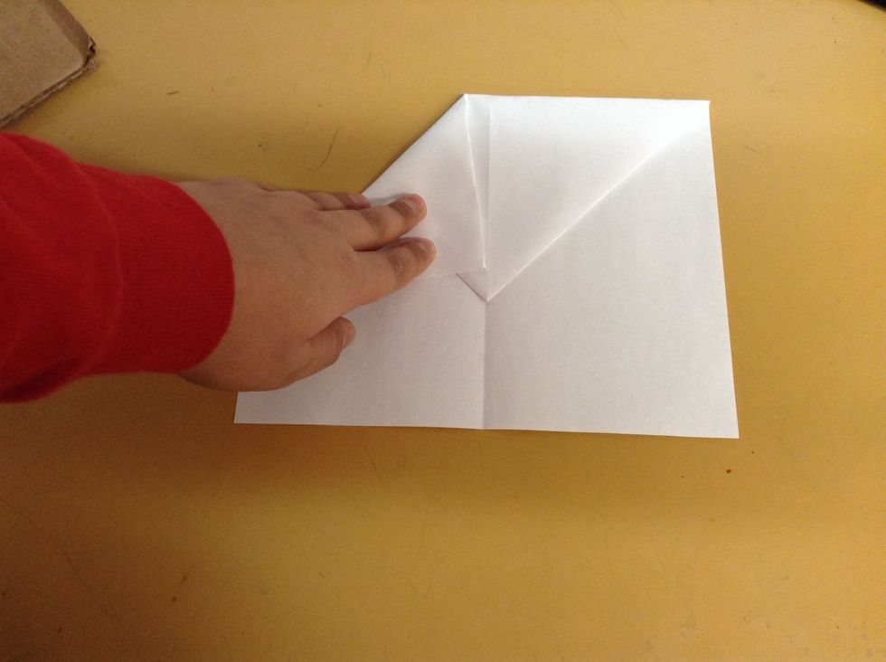 Just like the beginning fold the top 2 corners like this