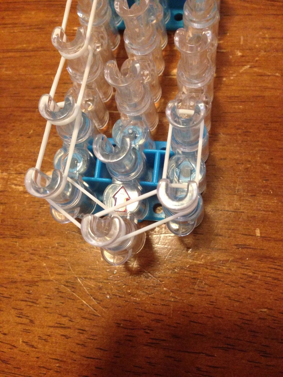 Just like the other side, add a band from the first right pin to the second right.