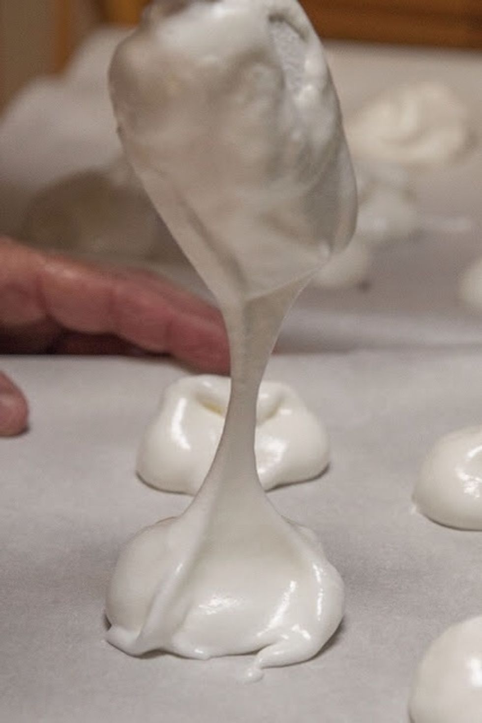 Just like this. Pop them into the oven and bake them for about 1 and 1/4 to 1 and 1/2 hours. When they're properly done, the meringues will sound crisp when you tap them on the bottom .