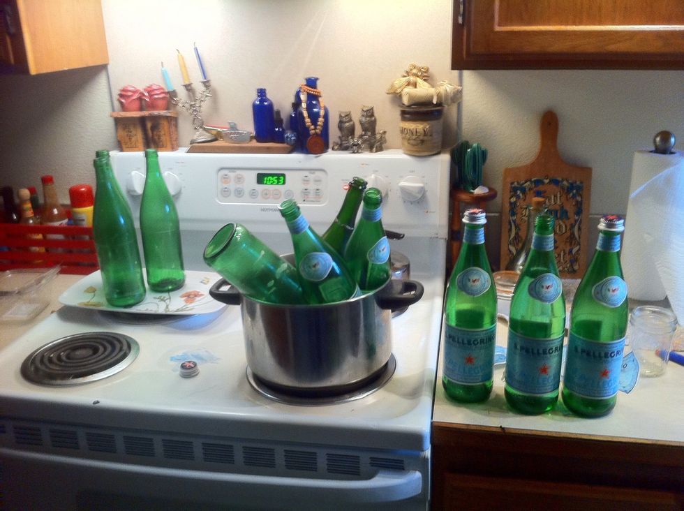 Just low heat bottles in water to easily remove labels.