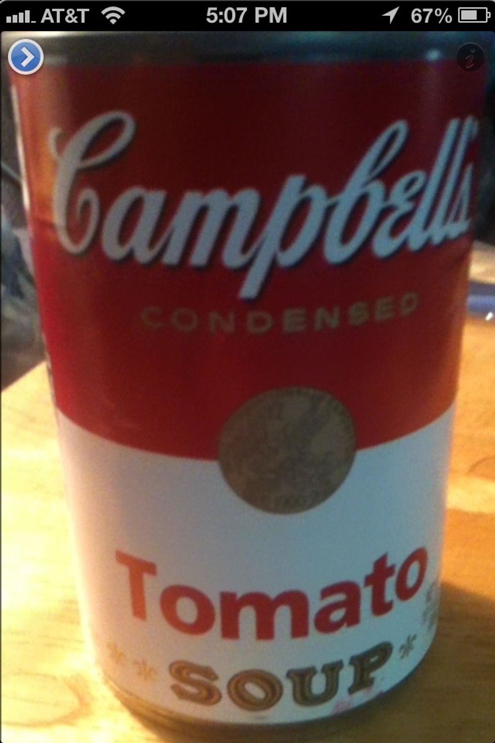 Just open VoiceOver and open the TapTapSee app. Aim your phone camera at an object and double tap the screen. In this example the voice said, "Campbell's tomato soup".