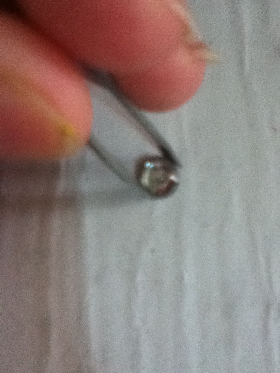 Just pick the rhinestone up