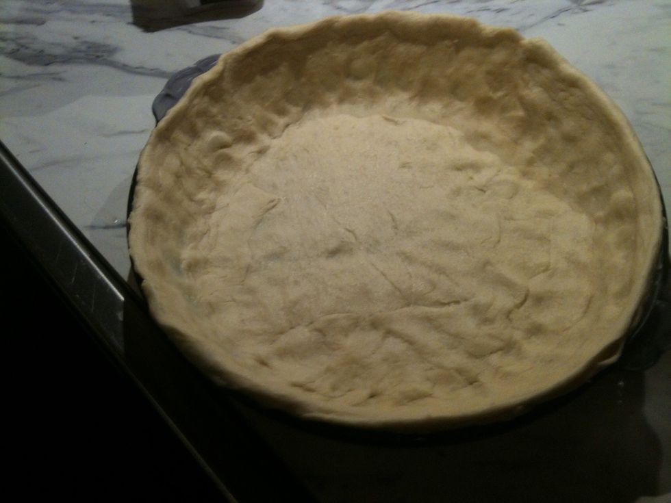 Just push it around all areas to make it even. I have a little lip above edge of pie plate to hold in the goodness!