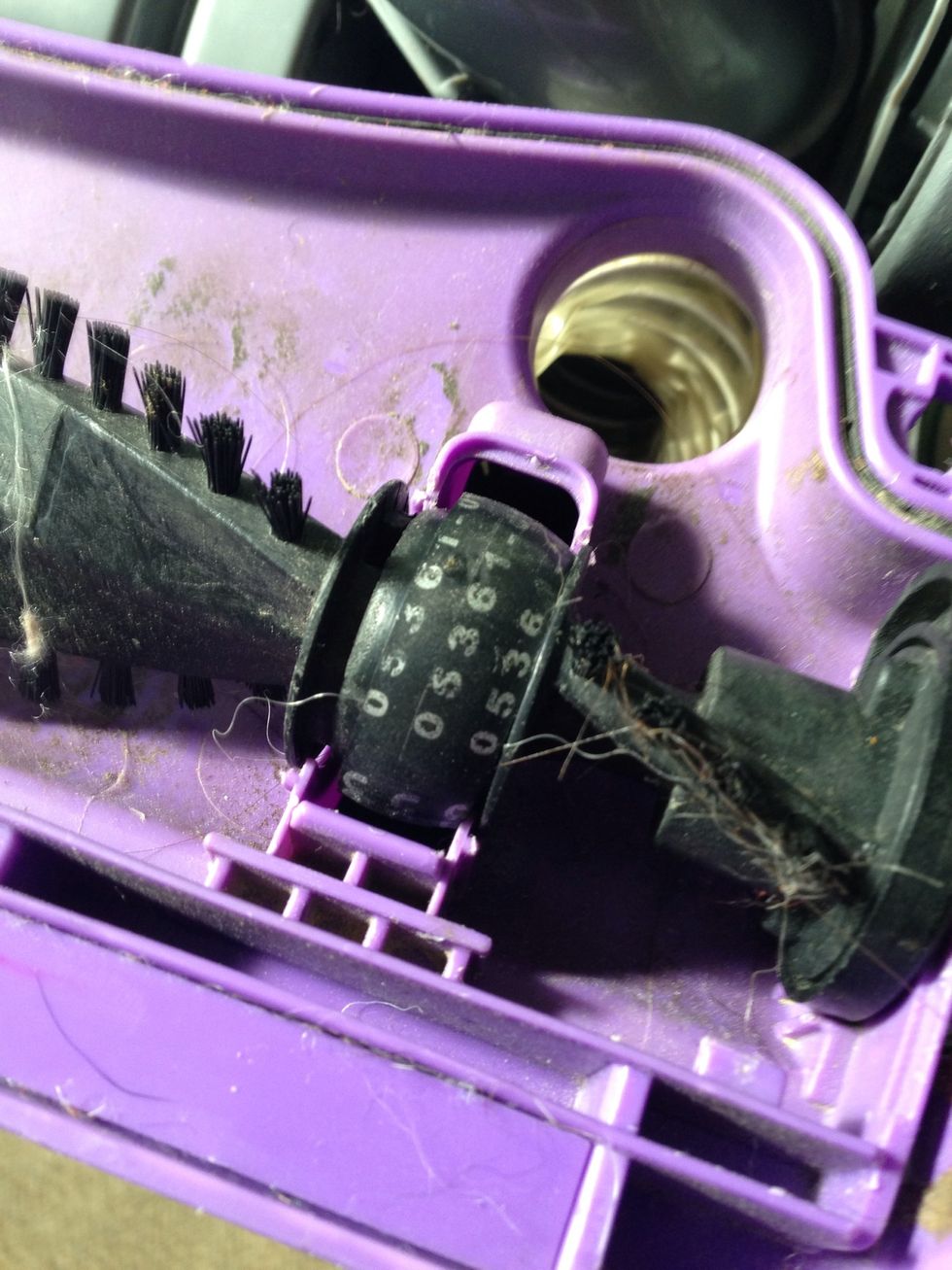 Just push the belt off the two prongs and remove the tool. Make sure the belt turns easily and is centered on the roller guide.