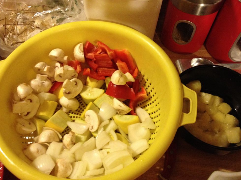 Kabob ingredients, onion, yellow squash, red bell pepper, mushroom and pineapple..