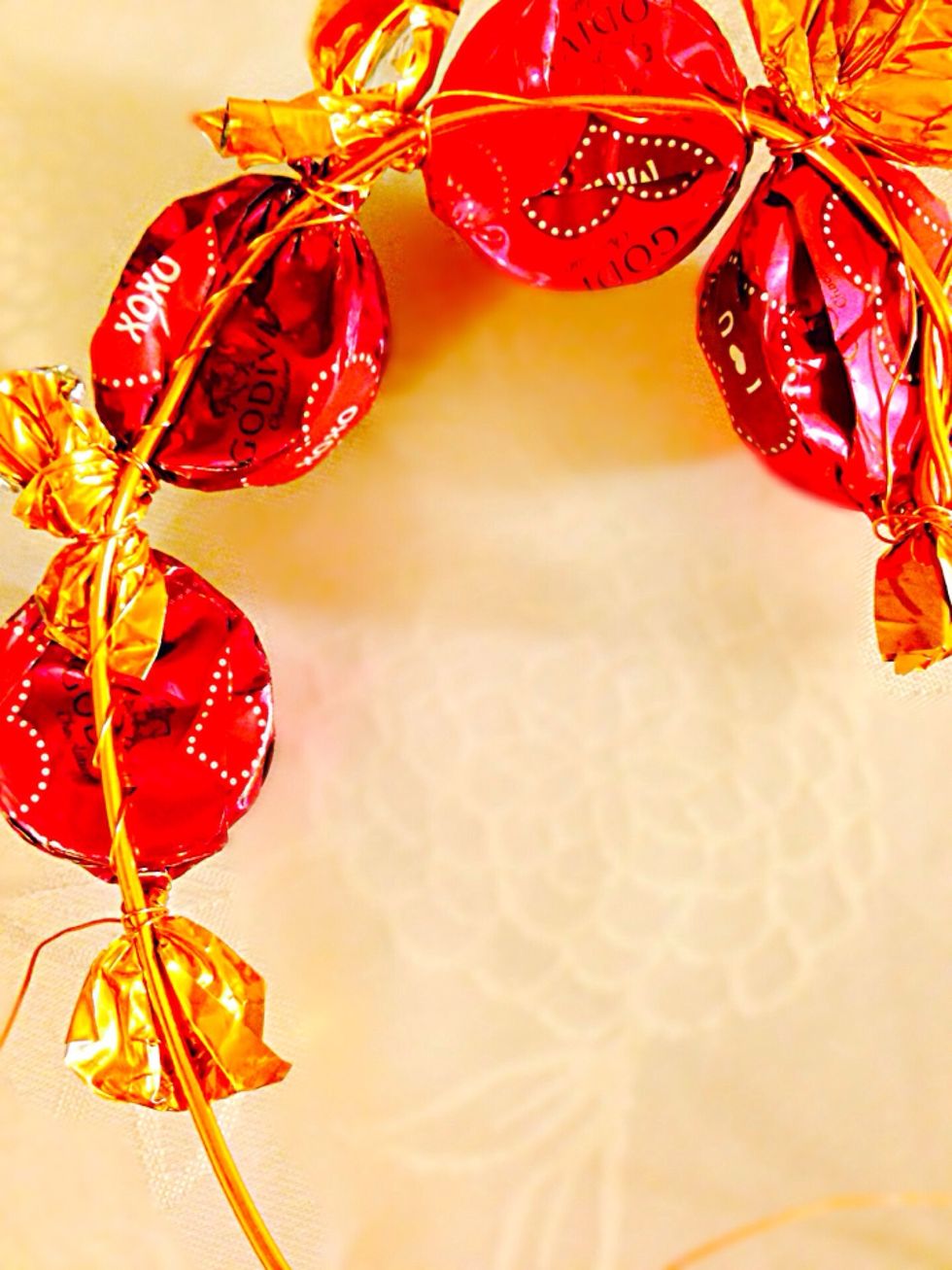 Keep adding the candy down the heart wire. This is how it looks from the back