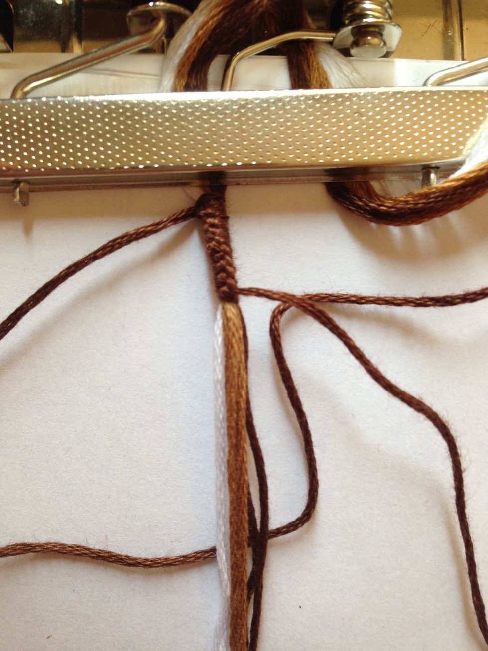 Keep alternating knots like this until you get to half the length of the buckle that you want. Then flip it to the other side and tie the same way, alternating knots...