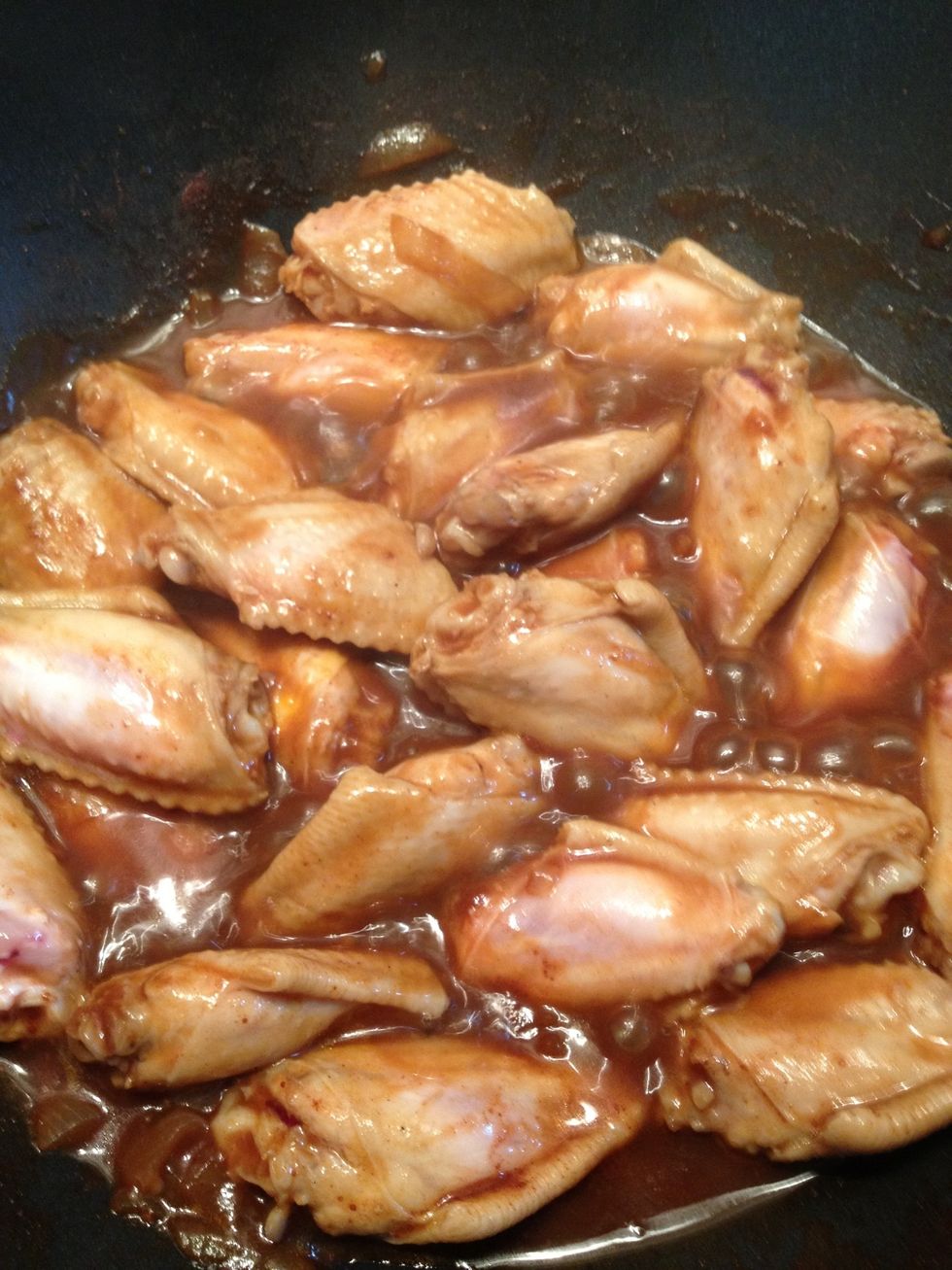 Keep boiling the sauce and chicken to thoroughly cook the chicken and reduce the sauce.