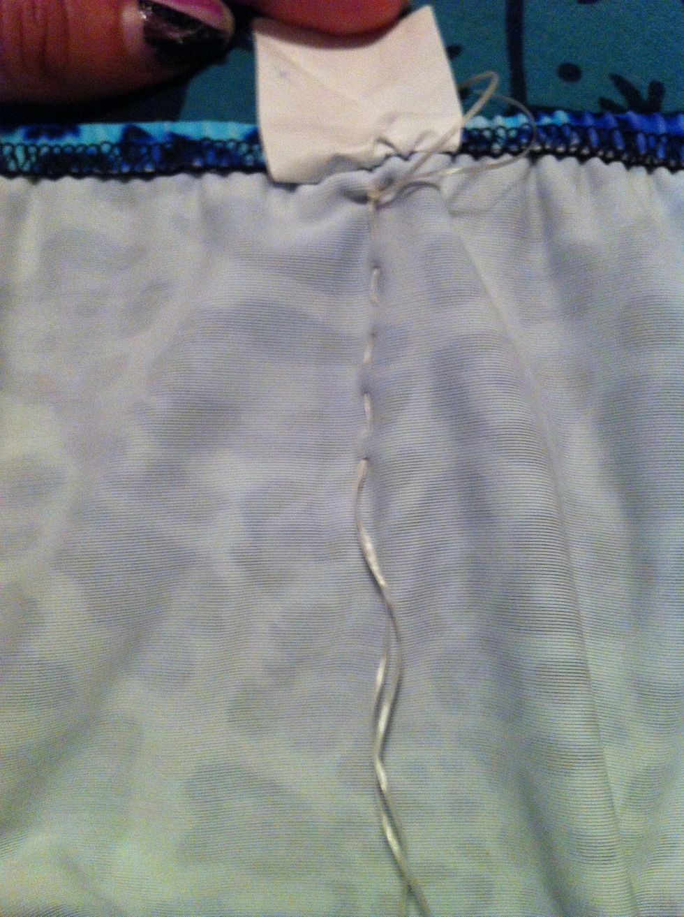 Keep doing the simple hand stitch down the bikini bottoms. Try to make even spaces between stitches.