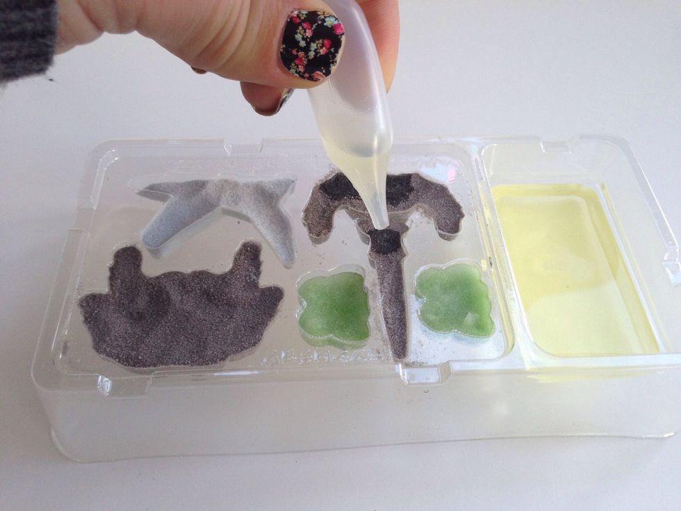 Keep dropping in small amounts until the powder all looks saturated