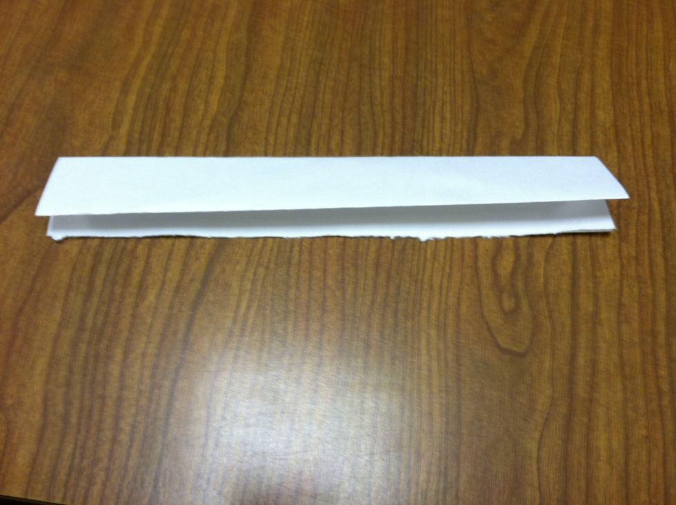 Keep folding the paper in half hamburger style.