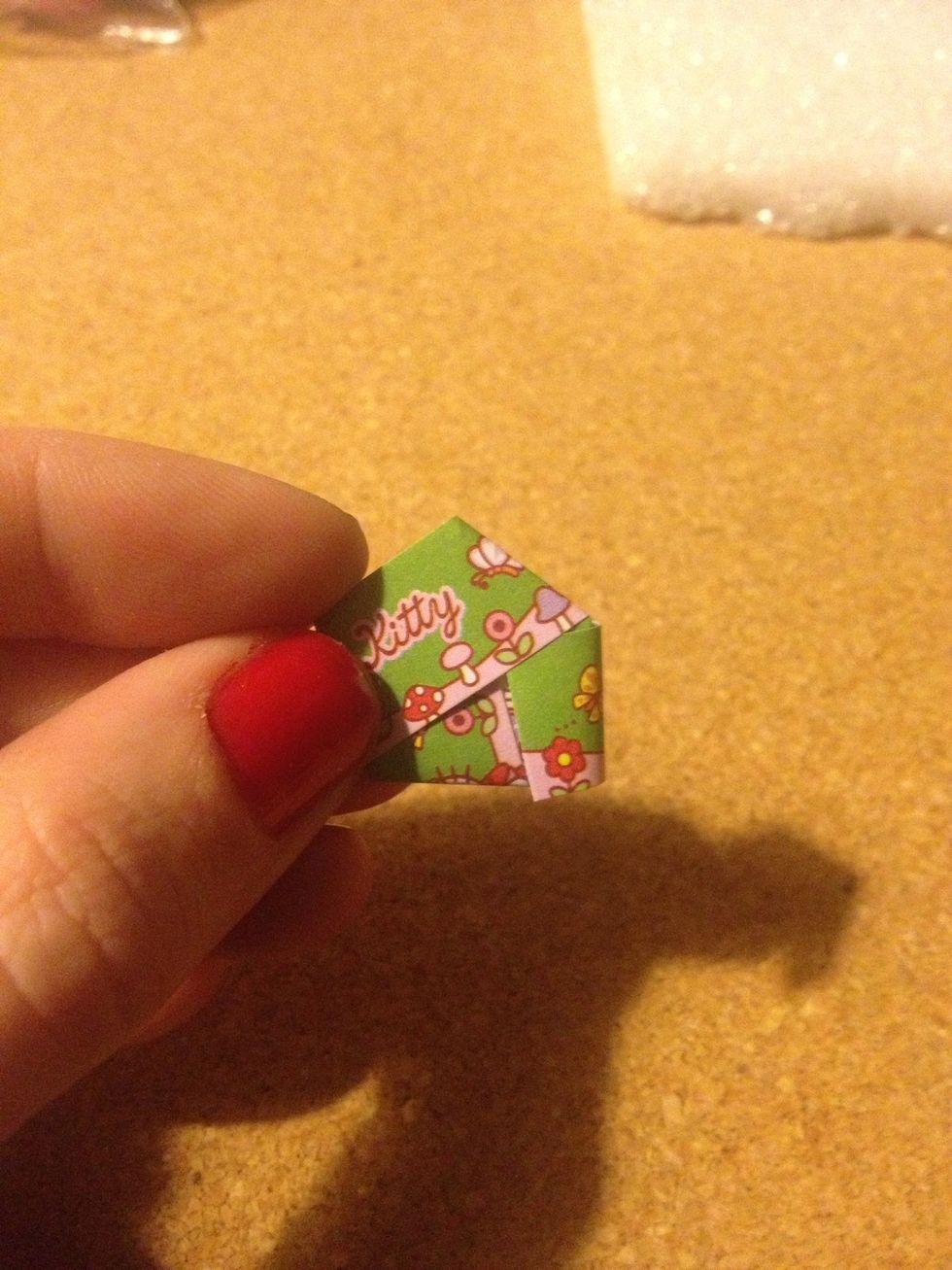 Keep folding until you can't fold any more and have a very small tail left. Fold that tail into the hexagon.