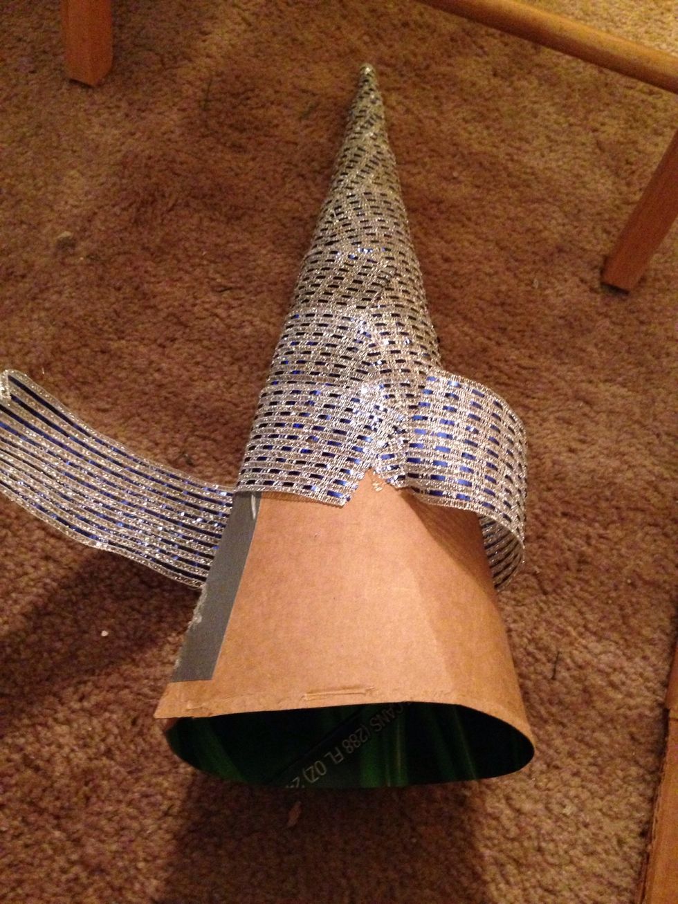 Keep gluing down bigger and bigger trapezoid shaped pieces of ribbon keeping a fairly straight line down the back