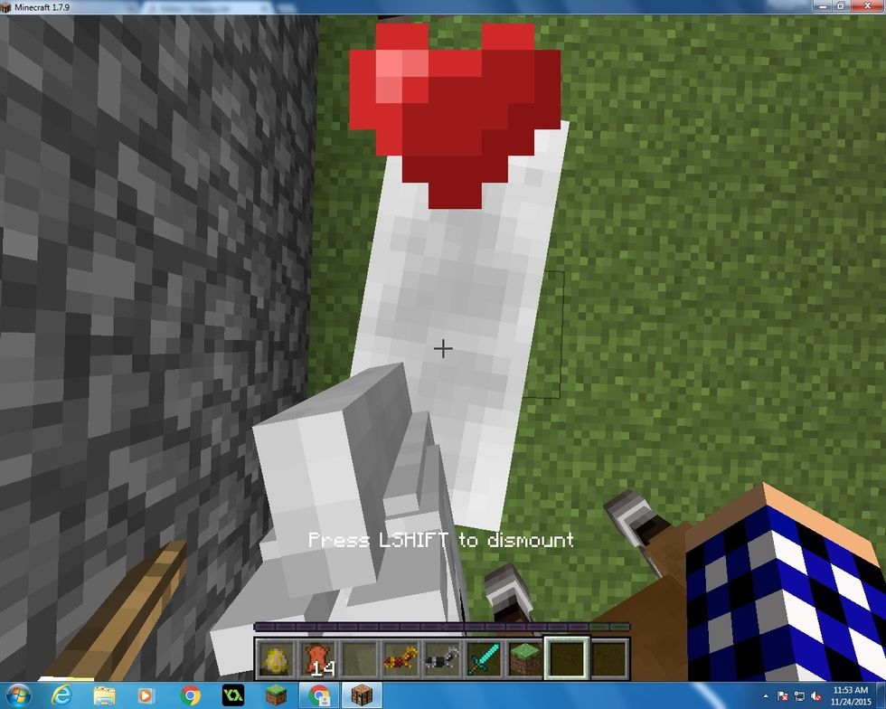 Keep going on and off the horse, right click to get on and shift to get off, once you have done it for a little soon a heart will pop up on the horse. That you means you have tamed it.