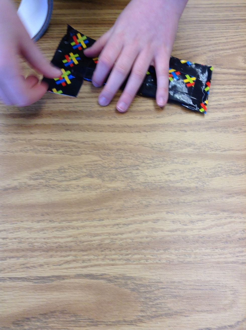 Keep it like that and cut some duct tape to tape together the side, not the top.