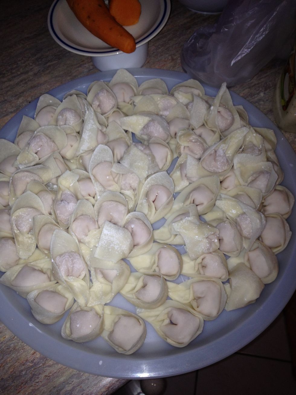 Keep making them until you finish the mince. Boil some water and put in a pot over a high stove setting..