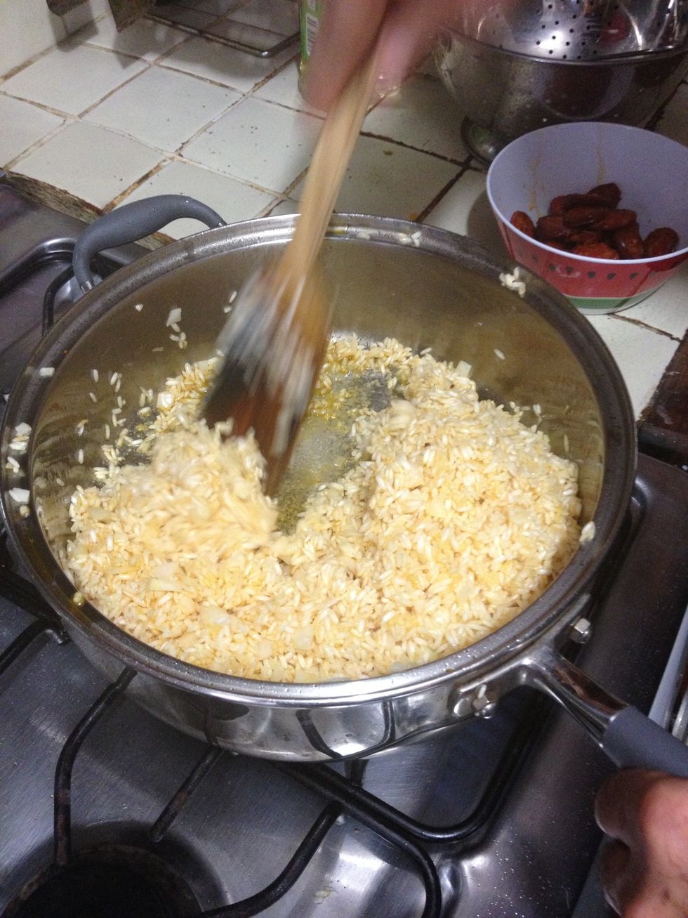 Keep moving the rice so it won't stick to the bottom. Continue until it becomes loose (not all stuck together) and is easier to move around.