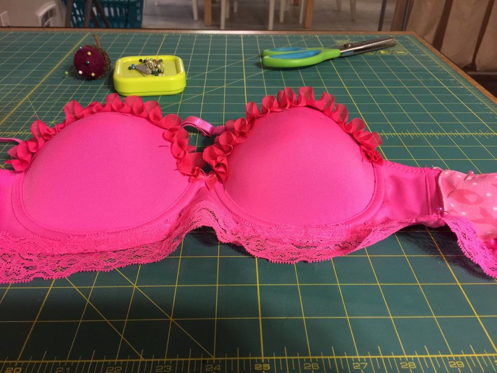 Keep moving through the process and place decorative items to the bra.
