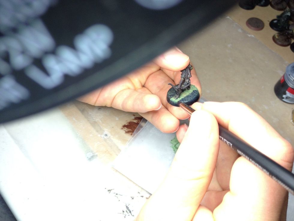 Keep priming the base. Try not to get any primer on the model.