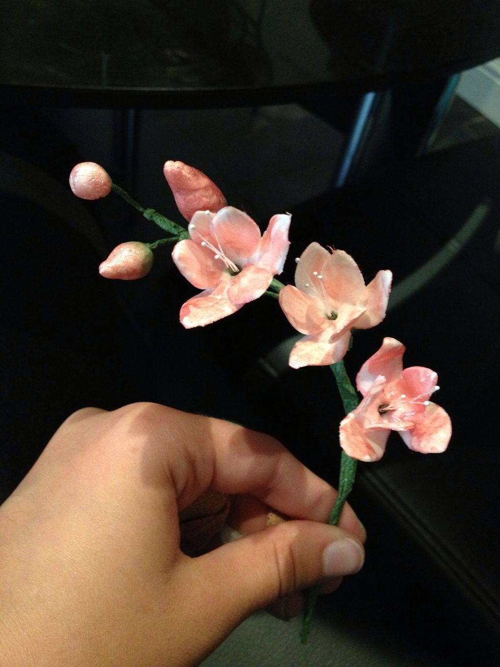 Keep putting the flowers on with the tape