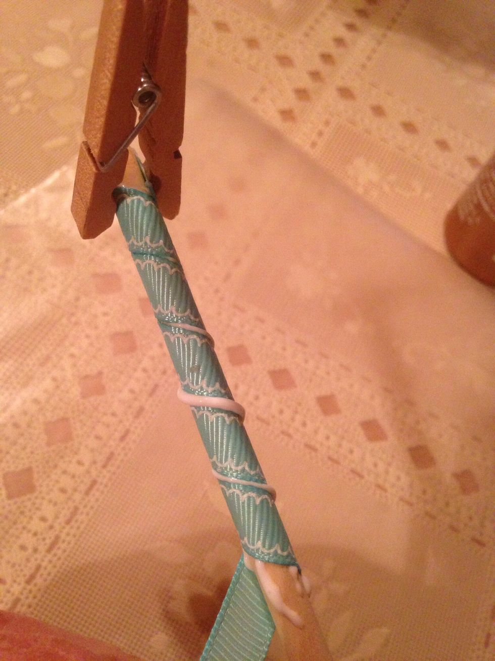 Keep ribbon tight as you wind ribbon over glue. Don't worry about glue that seeps up, you will spread that out later.