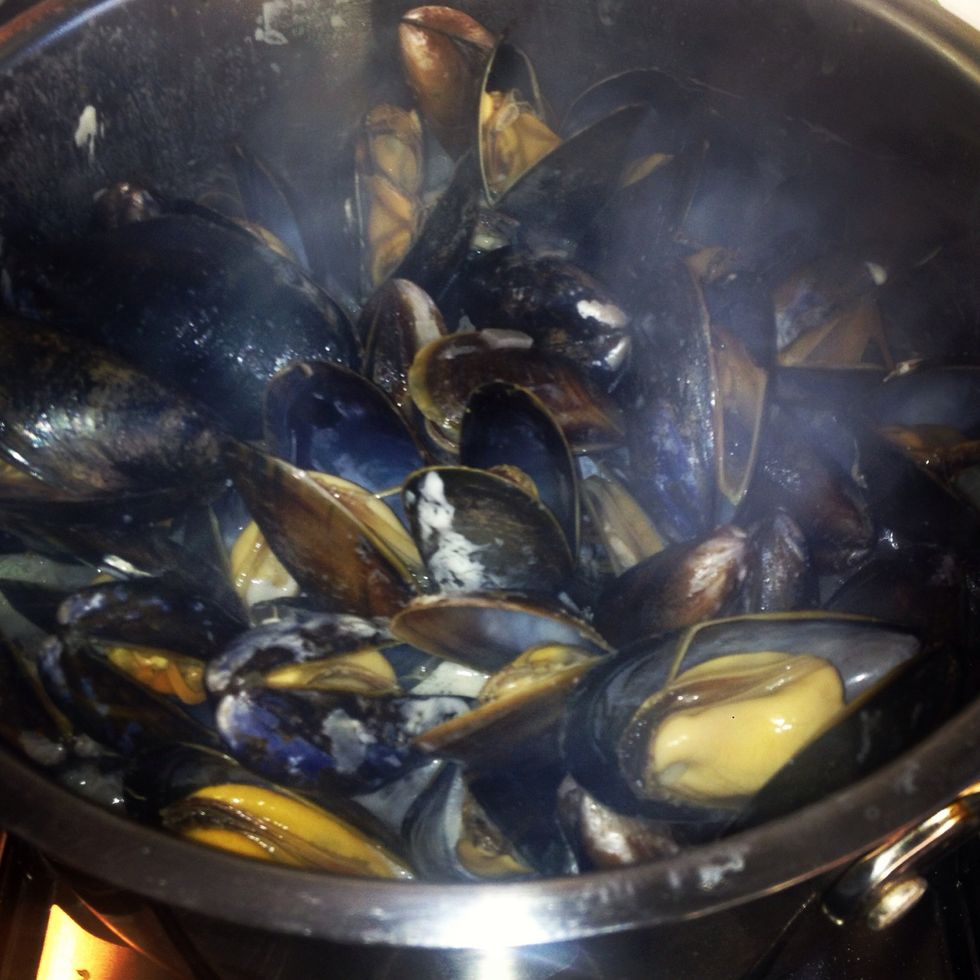 Keep shaking the pan so the sauce is steaming nicely inside the pan and the mussels are absorbing all those lovely flavours! The mussels should be ready within 10-15 on a medium heat!