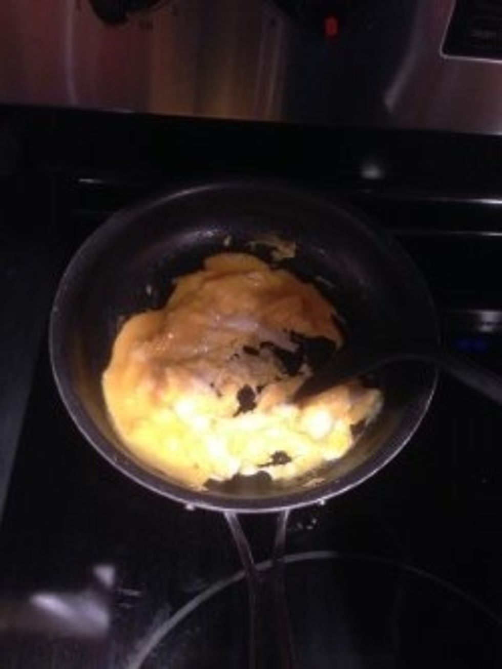 Keep stirring and mashing up the eggs with the plastic spoon.