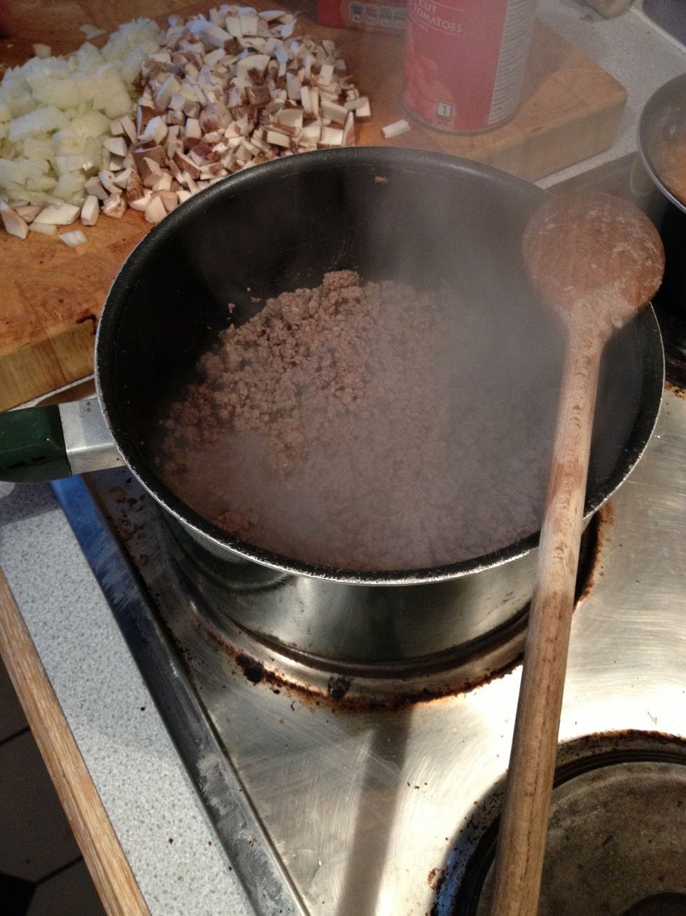 Keep stirring until water from meat is reduced (when sizzling)