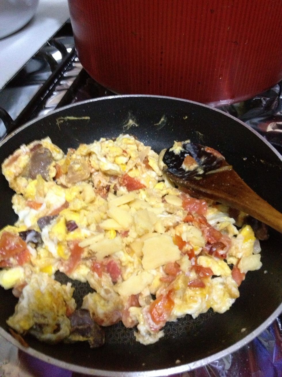 Keep string until the eggs and vegetables are all well done , finally but the chess and give it a quick stir