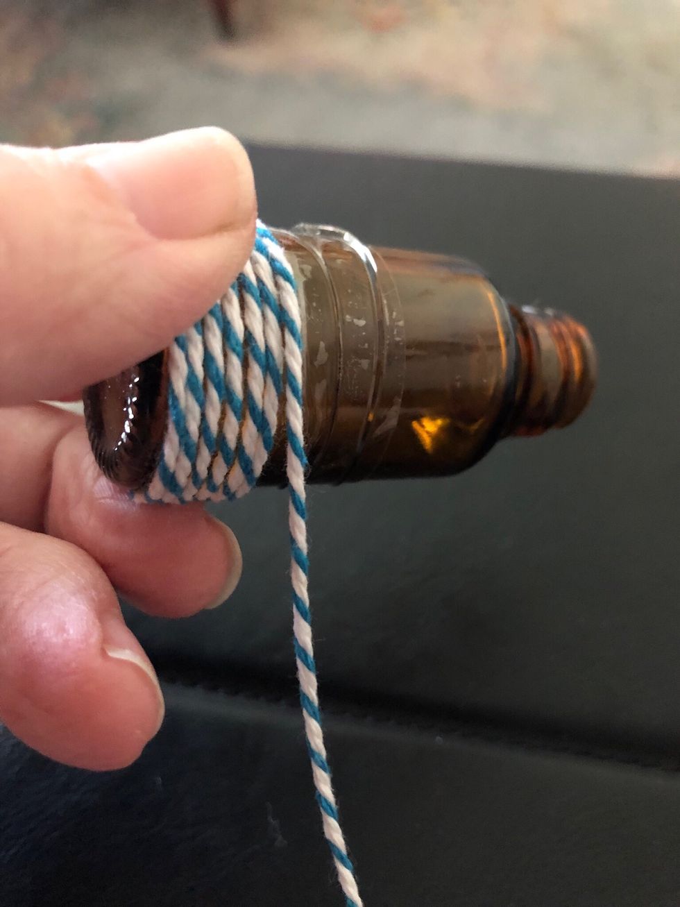 Keep taut, and push right up against previous strand. Pushing the twine tightly onto the tape to hold. Wrap until you get to top of tape, cut.