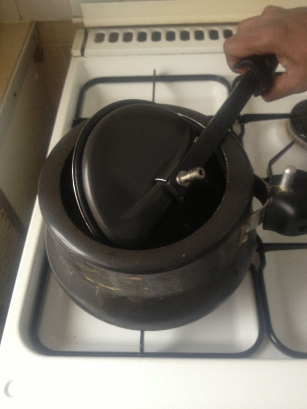 Keep the cooker on stove on low or medium flame.