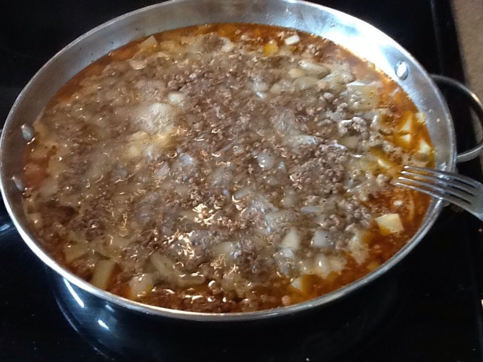 Keep the pan on medium to medium-high heat. It will come to a boil. Don't stir, don't reduce the heat. This will continue for 15-30 minutes, depending on the amount in the pan.