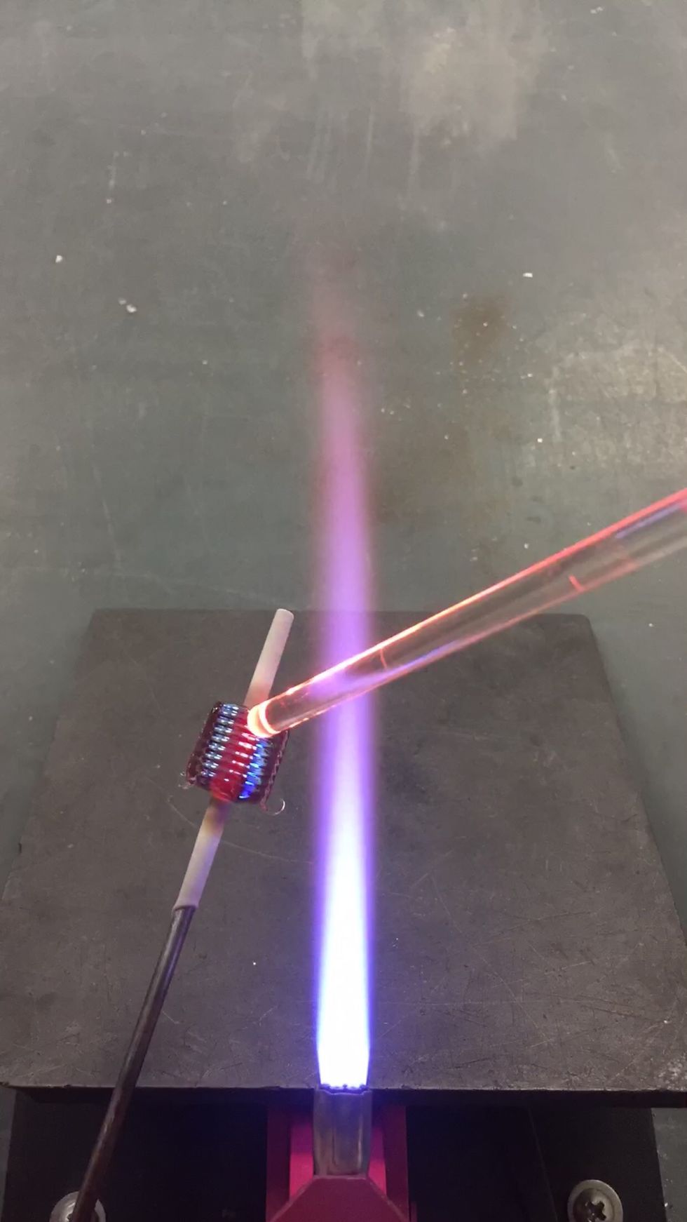 Keep the reduced bead out of the flame as you continue adding stripes.