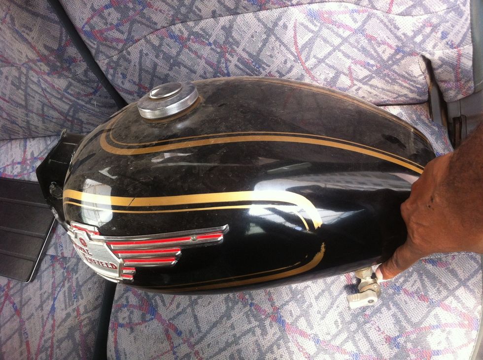 Keep the tank in a safe spot. Take care of the fuel tap, wrap it with cloth for protecting it until reinstallation.