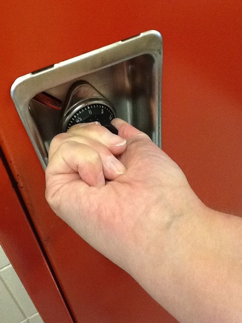 Keep turning the dial to the right and pull the door toward yourself.