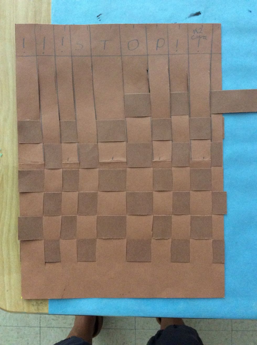 Keep weaving until you reach the top. Glue down ends.