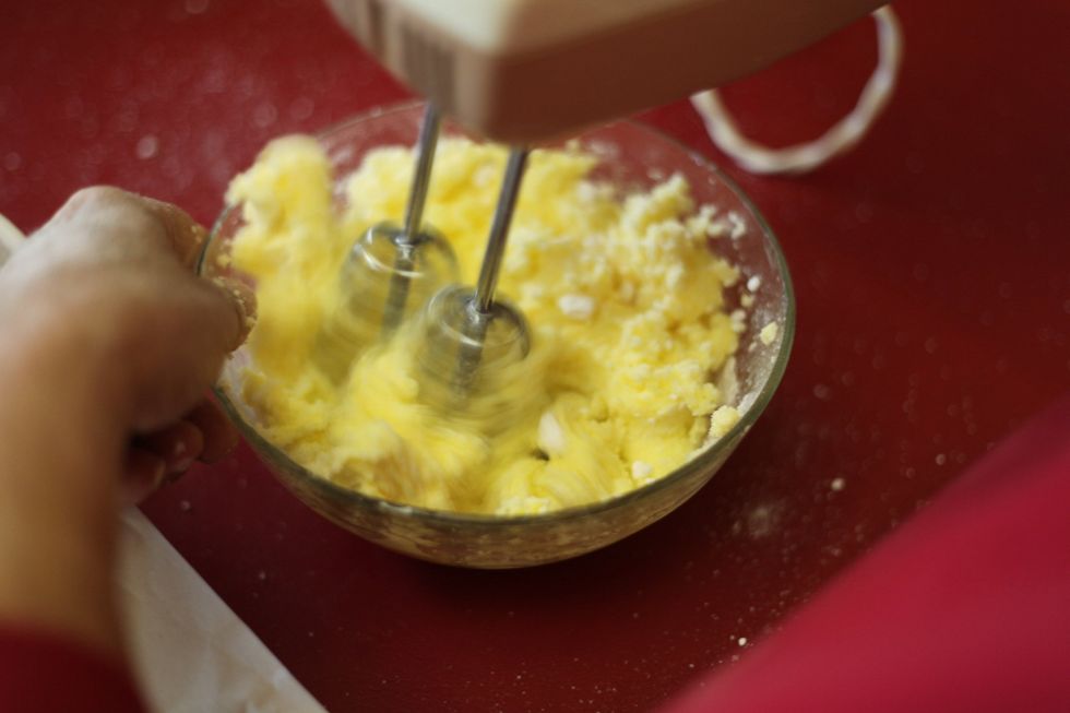 Keep whisking and you can increase the speed now that your sugar has blended with the butter.