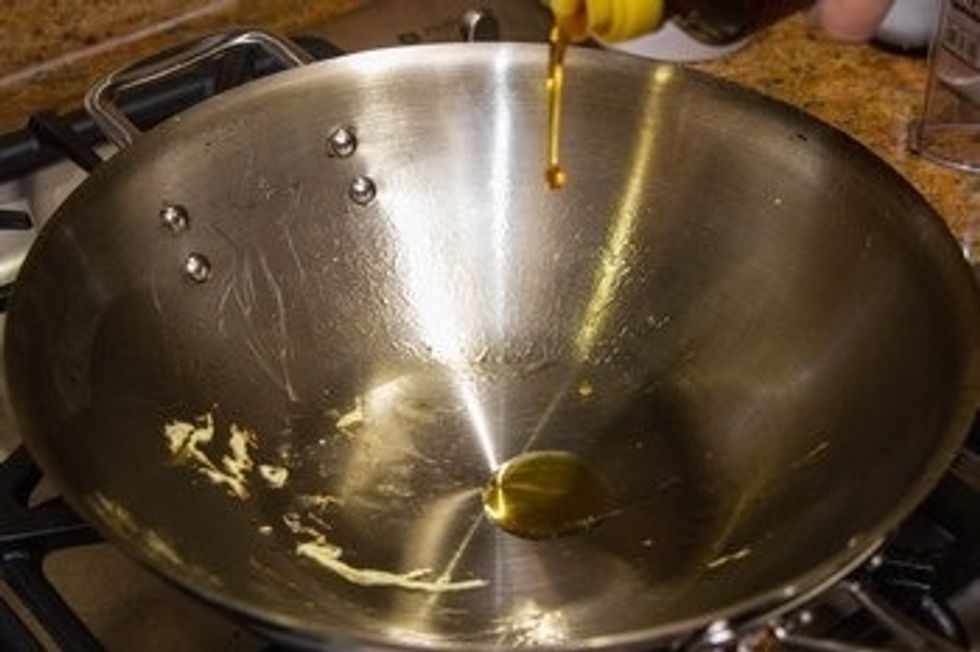 Keep wok on medium high heat and add the sesame oil.