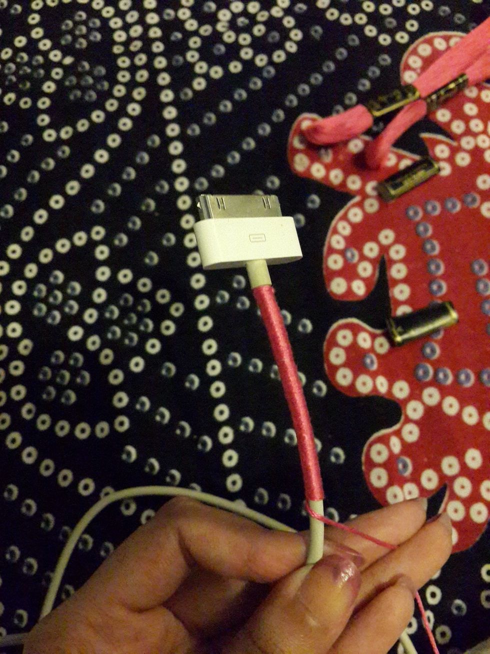 Keep wrapping it till the end, if your thread gets over knot it and start with another thread like how you did at the top